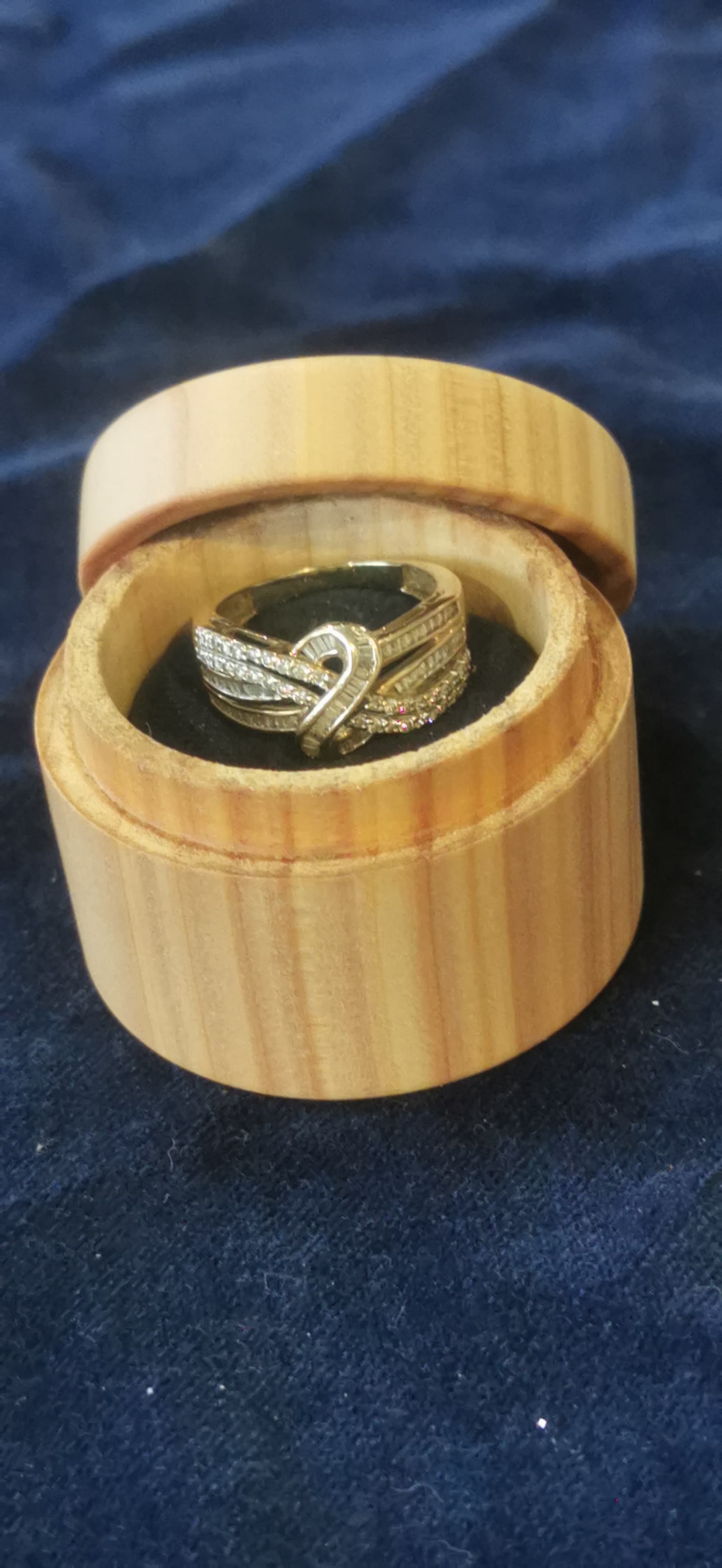 Custom-set ring displayed in a handmade timber box