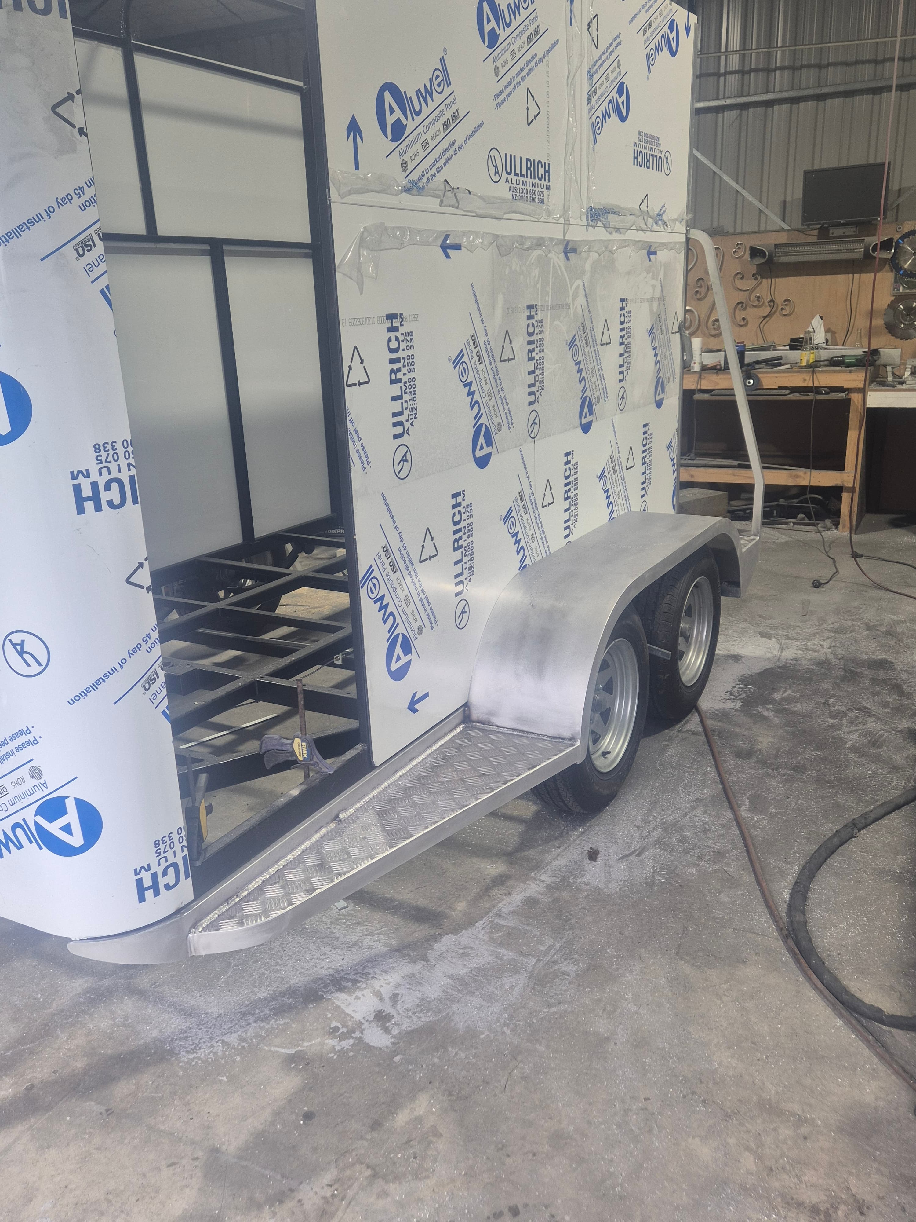 Aluminium trailer build in progress with checker plate guards